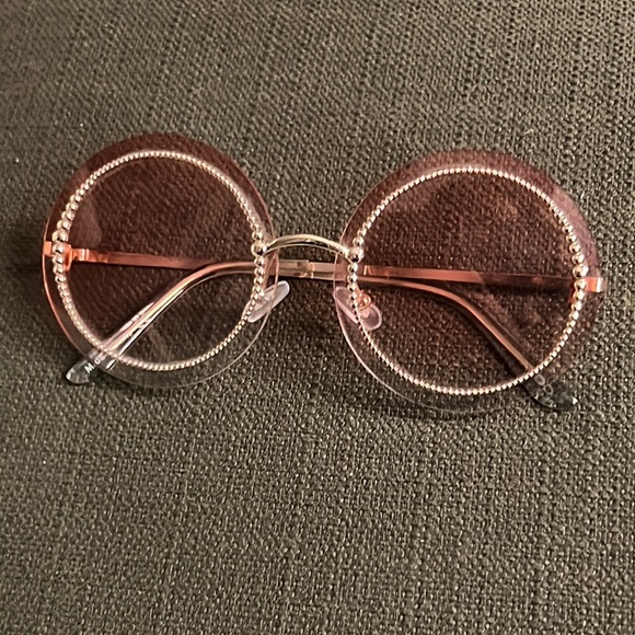 Sunglasses that have a soft color tint of pink - Picture 2 of 2